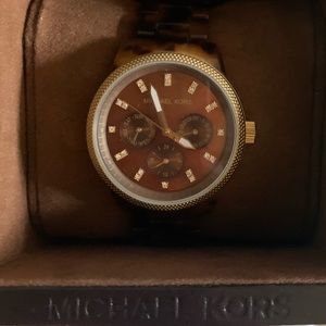 Michael Kors tortoise shell watch.